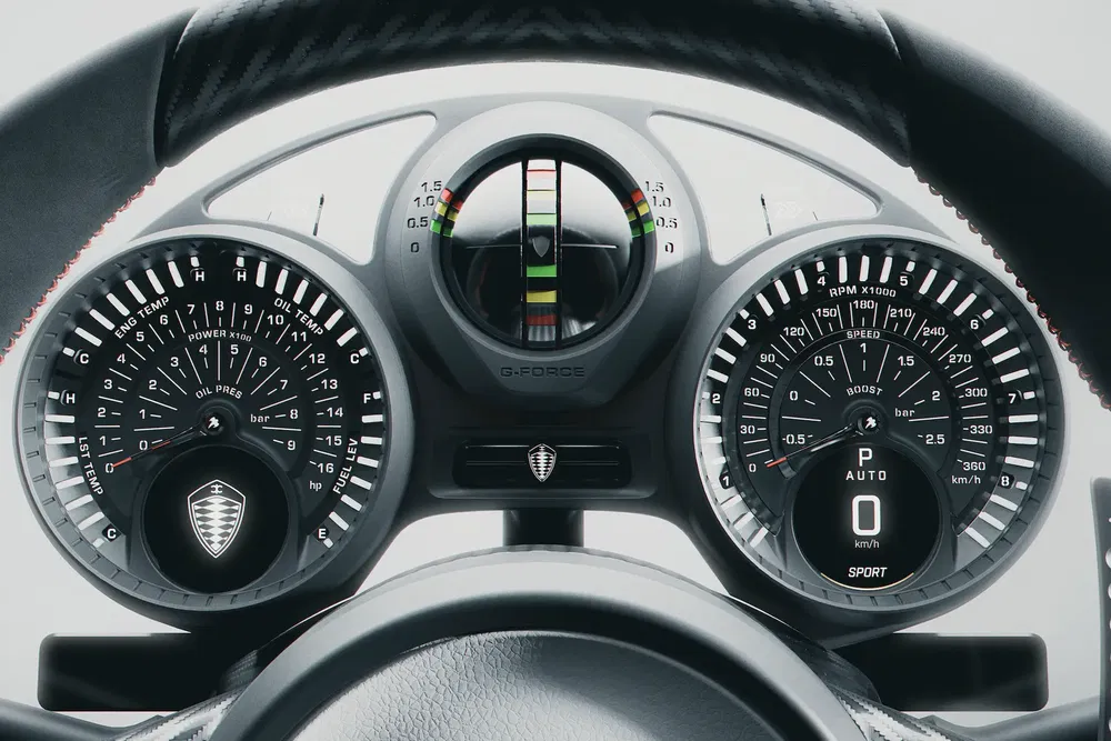 Tableau de bord Koenigsegg avec compte-tours, indicateur de pression et affichage numérique.