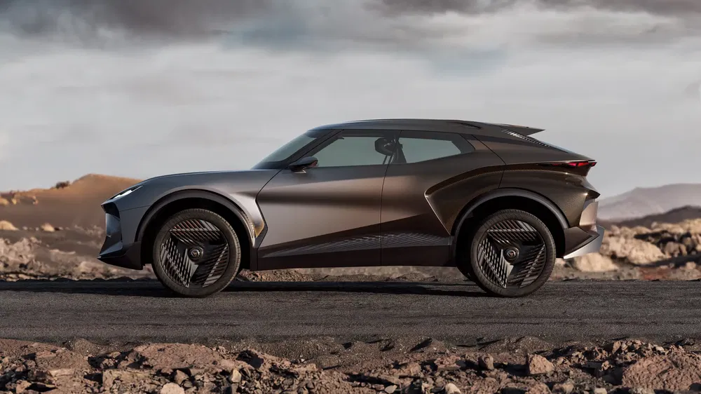 Concept car Lexus LF-Z sur route désertique avec design futuriste et profil aérodynamique.