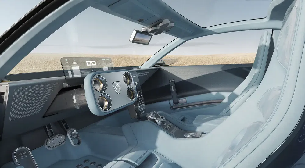 Intérieur futuriste de voiture Peugeot avec volant innovant et affichage numérique transparent.