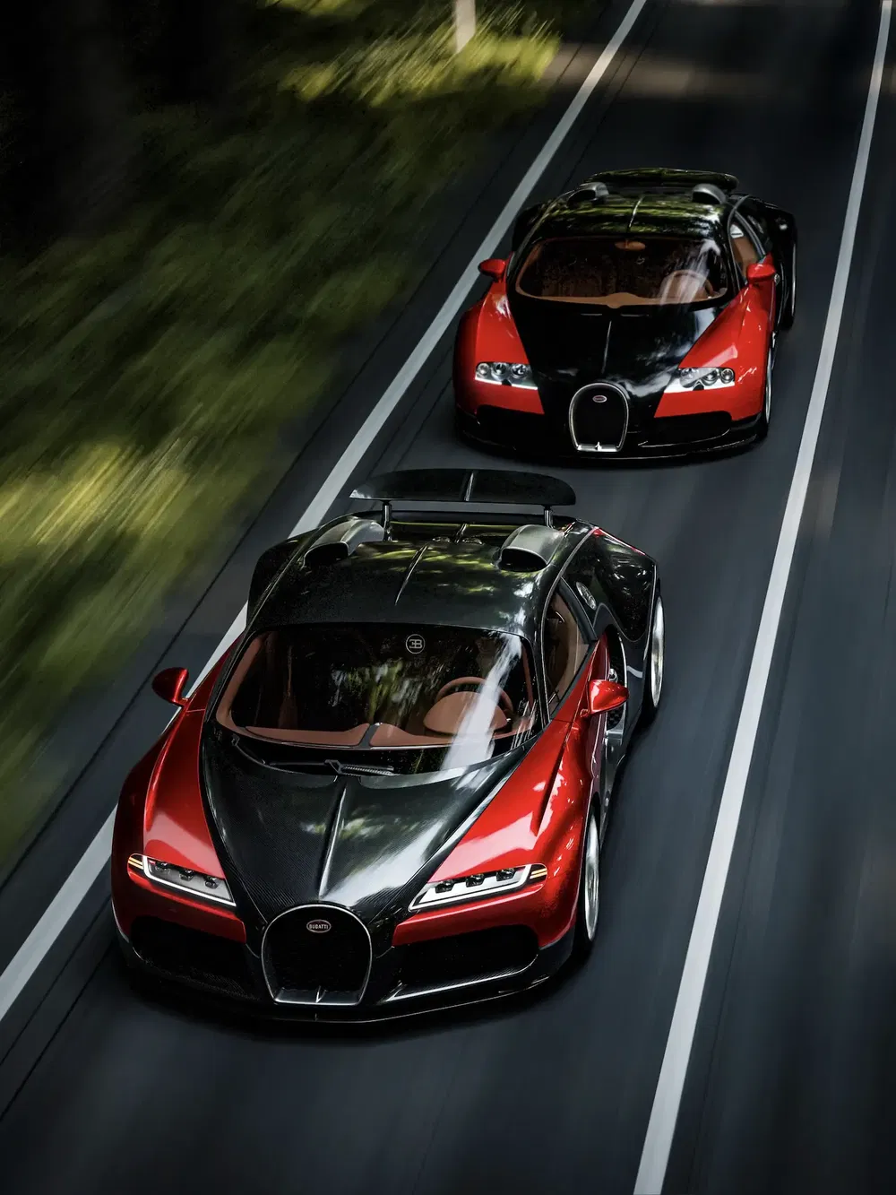 Deux Bugatti roulent rapidement sur une route entourée de végétation luxuriante.