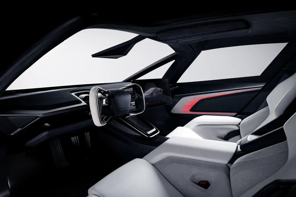 Intérieur futuriste du concept car Hyundai Prophecy, avec volant unique et sièges ergonomiques.