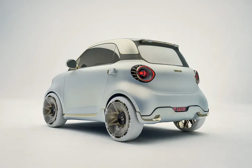 Elektrische Smart conceptauto met futuristisch ontwerp en innovatieve velgen, achteraanzicht.