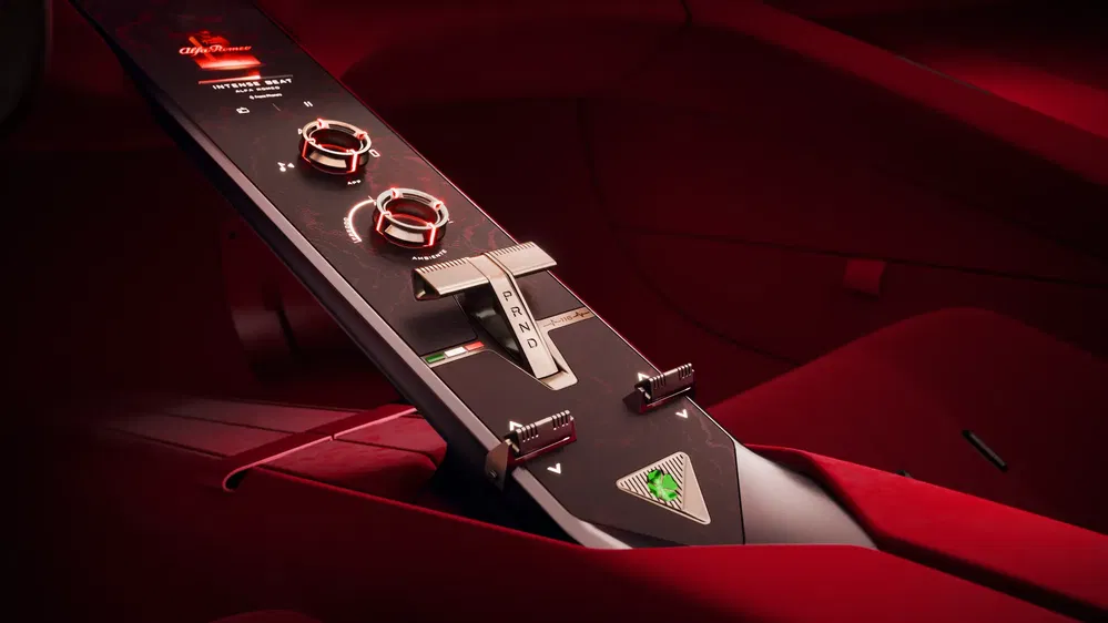 Console centrale Alfa Romeo rouge élégante avec sélecteur de vitesse et commandes circulaires.