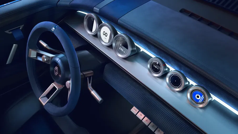 Intérieur de voiture Renault électrique avec tableau de bord futuriste et volant minimaliste.