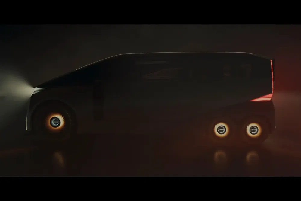 Concept van électrique avec éclairage futuriste sur roues et minimalisme dans l'obscurité.