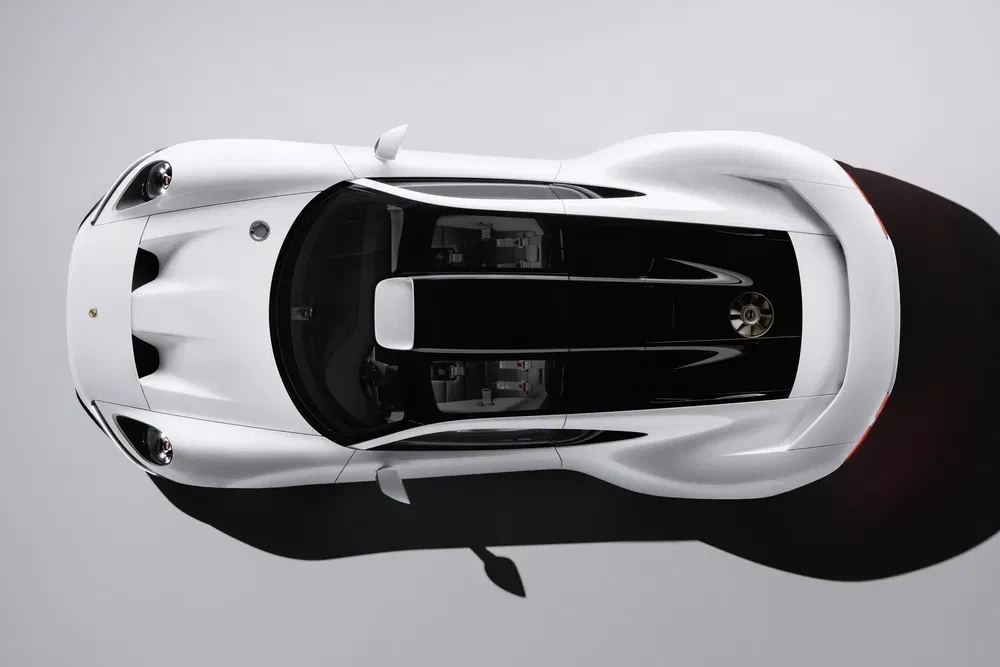 {"fr":"Vue aérienne d'une Porsche 911 blanche moderne, souligne design épuré et aérodynamique.","nl":"Bovenaanzicht van een moderne witte Porsche 911, benadrukt strak en aerodynamisch ontwerp."}