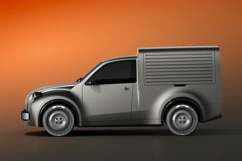 {"fr":"Illustration d'un utilitaire compact moderne avec un design rétro, fond dégradé orange.","nl":"Illustratie van een moderne compacte bestelwagen met retro-ontwerp, oranje kleurverloop achtergrond."}