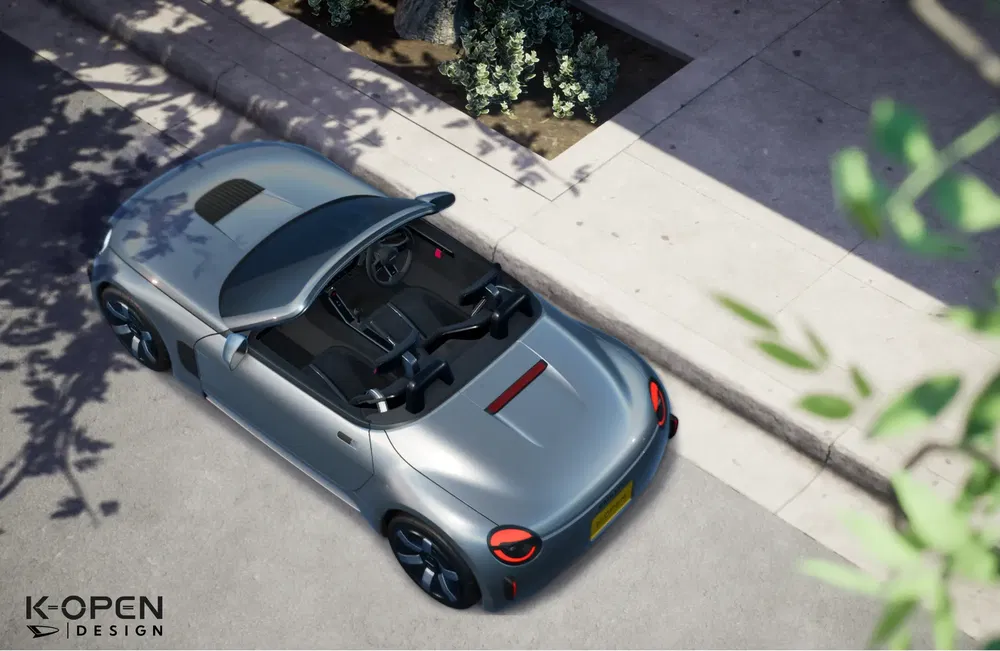 Luchtfoto van een zilveren K-Open Design cabriolet geparkeerd op een schaduwrijke straat.