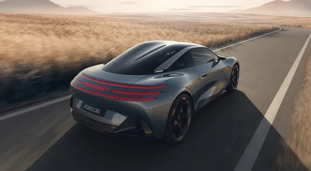 {"fr":"Concept car MG RC 6 sur une route déserte au crépuscule, design futuriste et aérodynamique.","nl":"MG RC 6 conceptauto op een lege weg bij schemering, futuristisch en gestroomlijnd ontwerp."}