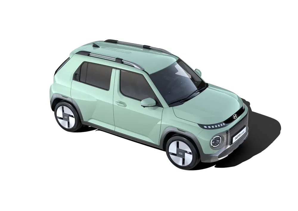 Luchtfoto van een lichtgroene Hyundai Exter met modern en compact ontwerp, schaduw projiceren.