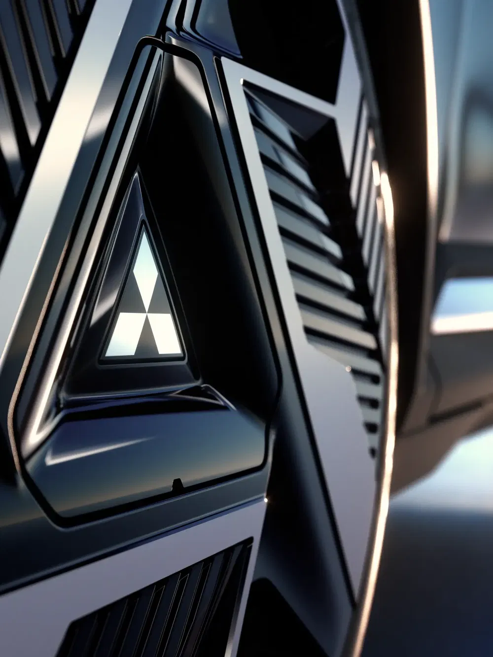 Close-up van de voorgrille van een voertuig met een futuristisch en geometrisch ontwerp.