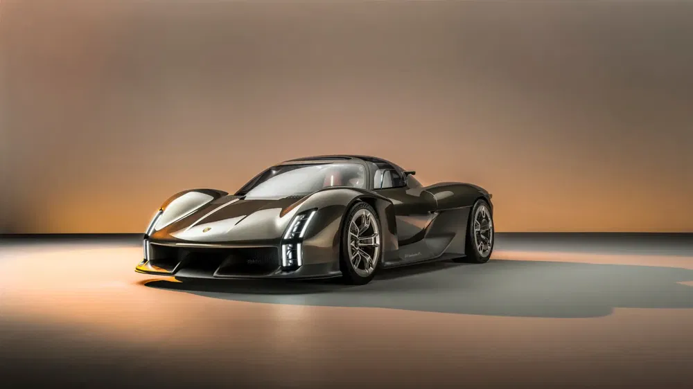 Supercar Porsche Mission X grise avec design futuriste exposée en studio minimaliste.