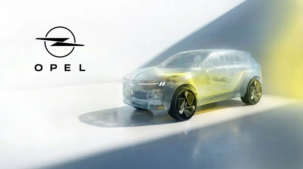 {"fr":"Concept car Opel futuriste illuminé par des faisceaux de lumière, logo Opel à gauche.","nl":"Futuristische Opel conceptauto verlicht door lichtstralen, Opel-logo links."}