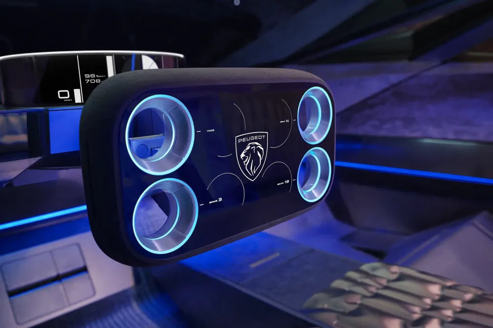 {"fr":"Volant numérique futuriste de voiture Peugeot avec éclairage bleu et logo central.","nl":"Futuristisch digitaal stuur van Peugeot-auto met blauw licht en centraal logo."}