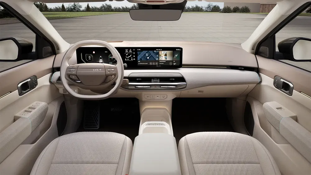Moderne interieur van de Kia EV9 met digitaal dashboard en strak ontwerp.