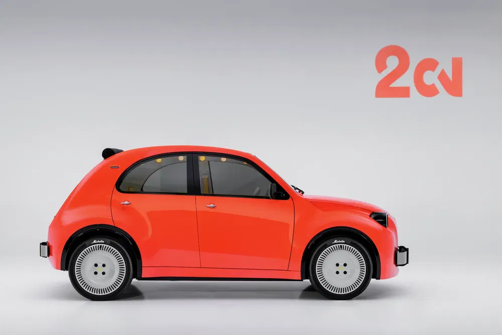Concept car électrique Citroën 2CV moderne rouge avec design élégant et allure rétro.